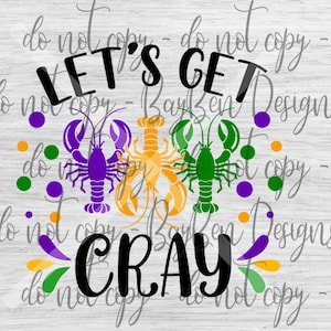 May include: Let's Get Cray!  A colorful design featuring three crawfish in purple, green, and yellow with Mardi Gras beads and the text "Let's Get Cray!"