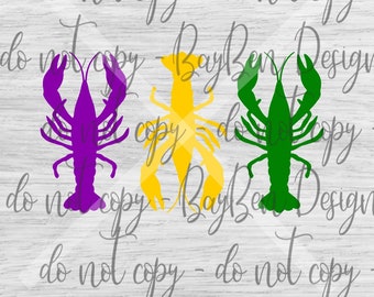 May include: Three colorful crawfish silhouettes in purple, yellow, and green are displayed on a light wood-grain background. The image includes the text "BayBen Designs" and "do not copy".