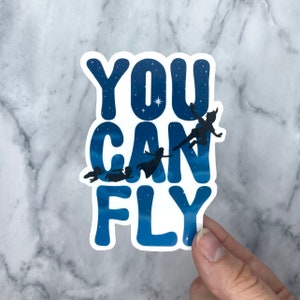May include: A blue and white sticker with the text "You Can Fly" and silhouettes of Peter Pan and the Lost Boys flying.