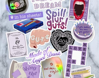 May include: A set of stickers with various designs, including a heart with the word "lacy" written inside, a fist with the word "GUTS" written on the knuckles, a purple cake with candles, a mirror with the words "bad idea, right?" written on it, and a bed with the words "Making the bed" written on it.