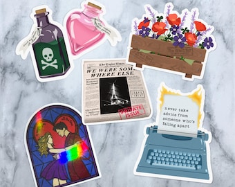 May include: A set of six stickers featuring various designs, including a heart-shaped bottle, a newspaper clipping, a typewriter, a flower arrangement, and a stained glass window with a couple dancing. The newspaper clipping features the text "The Taylor Times" and "We were somewhere else". The typewriter has the text "never take advice from someone who's falling apart".