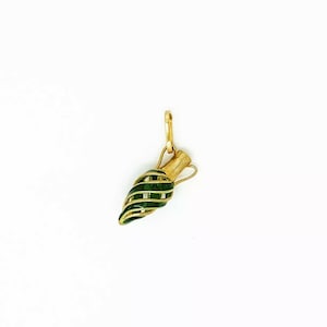May include: A gold-coloured pendant shaped like an amphora, featuring a green, spiral-wrapped design. The pendant has a small loop at the top for a chain. The design is detailed and the colours are vibrant. The pendant is likely made of metal.