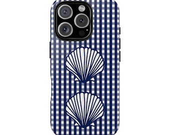 May include: A phone case with a navy blue and white gingham pattern. Two white seashell designs are centered on the case. The phone case has a glossy finish and a camera cutout.