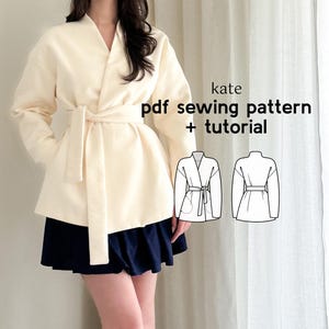 May include: A woman wearing a cream-colored wrap jacket with a tie belt. The image also includes a line drawing of the jacket in front and back views. The text "kate pdf sewing pattern + tutorial" is displayed on the image.