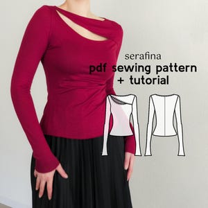 May include: A woman wearing a long-sleeved, burgundy top with a cut-out neckline. The top is fitted and has a slight ruffle detail at the waist. The model is wearing a black skirt. The image also includes a line drawing of the top, with the text "serafina pdf sewing pattern + tutorial".