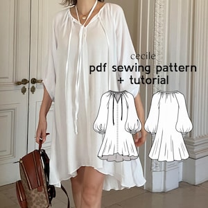 Pode incluir: Um vestido branco com um laço no pescoço. O vestido tem um caimento solto e é mostrado em uma modelo. A imagem também inclui um desenho de linha do vestido com o texto "cecile pdf sewing pattern + tutorial".