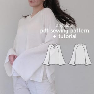 Könnte beinhalten: Ein weißes Langarmhemd mit V-Ausschnitt und weiten Glockenärmeln. Das Hemd hat seitliche Schlitze. Das Bild zeigt auch eine Strichzeichnung des Hemdenmusters mit dem Text "angeline pdf sewing pattern + tutorial".