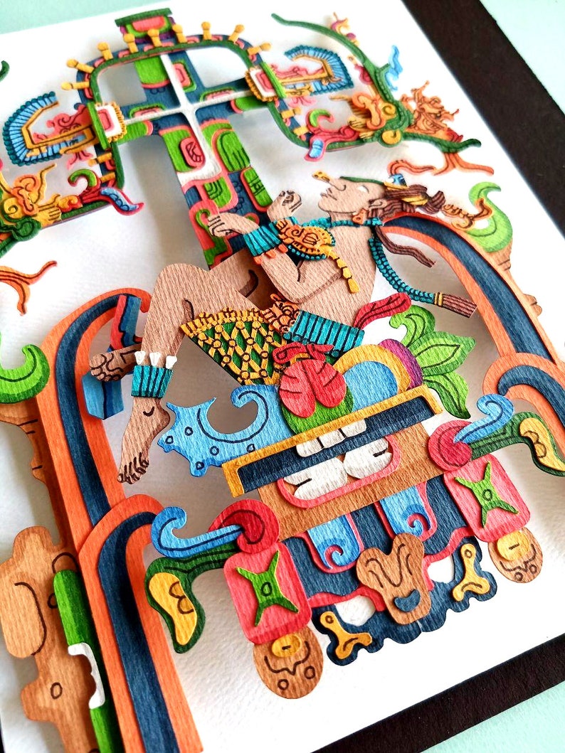 May include: A colorful paper cut-out art piece depicting a figure sitting on a throne with a cross behind them. The figure is adorned with intricate details and vibrant colors, including blue, green, red, yellow, and orange.