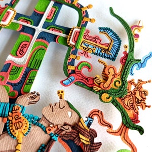 May include: A paper cut-out art piece depicting a stylized figure with a crown and a cross. The figure is surrounded by intricate details in shades of green, blue, orange, and yellow.