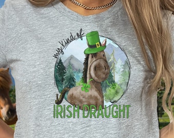 May include: A gray short-sleeved t-shirt with a graphic of a brown horse wearing a green hat and a green shamrock. The text "my kind of Irish Draught" is printed below the graphic.