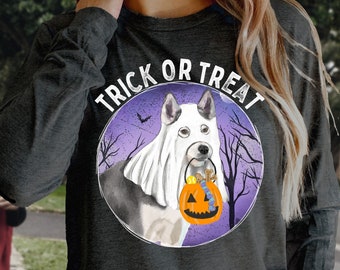 May include: A dark gray long-sleeved sweatshirt with the text "Trick or Treat" in a purple circle. A white dog with a ghost sheet is holding a pumpkin bucket.