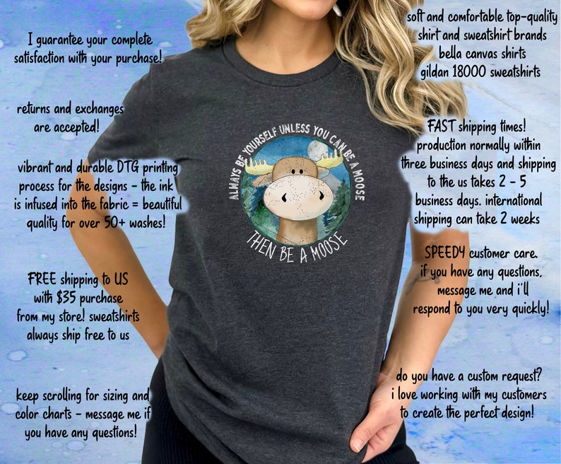 May include: A grey t-shirt featuring a moose illustration and the text "Always be yourself unless you can be a moose, then be a moose".