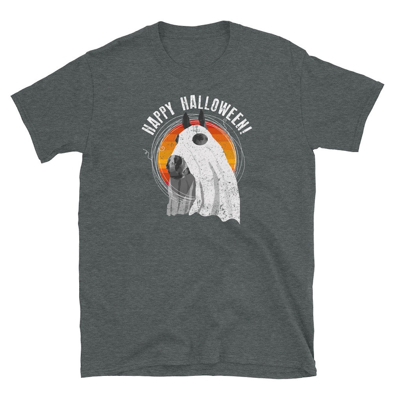 May include: A dark heather grey t-shirt with a graphic of a horse wearing a ghost costume. The text "Happy Halloween!" is printed in white above the horse.