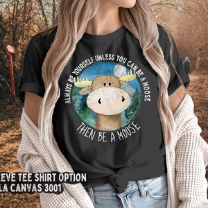 May include: Black short-sleeved t-shirt with a moose illustration and the text "Always be yourself unless you can be a moose then be a moose".