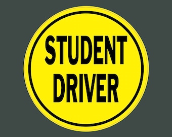 May include: Yellow round sign with a black border and the text "STUDENT DRIVER" in black.