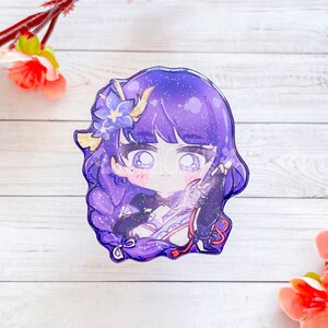 May include: A purple and blue anime character with a flower in her hair. The character is holding a sword and has a sparkly background.