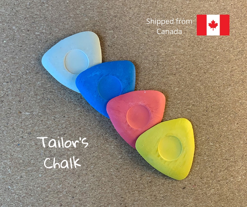 May include: Four triangular tailor's chalk pieces in white, blue, red, and yellow.  The chalk pieces are arranged in a row, with the white chalk piece at the top and the yellow chalk piece at the bottom.  The text "Tailor's Chalk" is written in white below the chalk pieces.