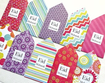 May include: Nine colorful envelopes with a white square label on each that says "Eid Mubarak".
