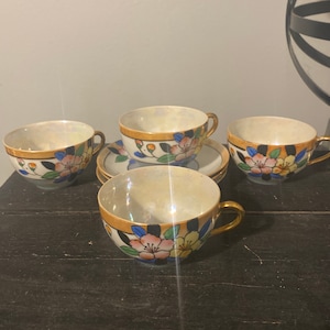 Vintage Lusterware Tea Cups (4) and Saucers (3) - Hand-painted.  Made in Japan.