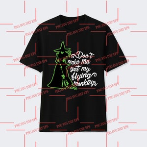 May include: A black t-shirt with a green silhouette of a witch holding a broom and the text "Don't make me get my flying monkeys".
