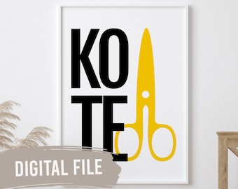 May include: A white framed printable with black text that reads "KO TE" and a yellow pair of scissors.