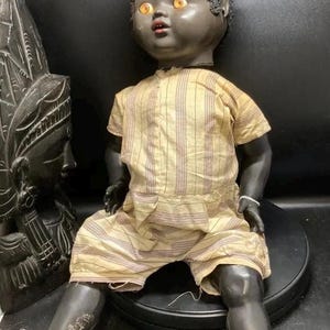 1950s vintage walking boy black palitoy doll ,hard plastic, sleeping   eyes,dressed , black wig