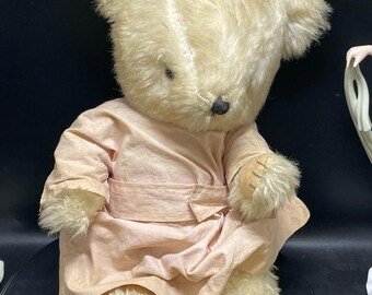 vintage  teddy bear in pink dress