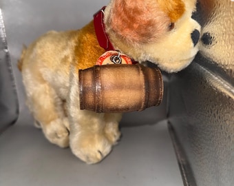 Small soft toy dog Steiff ,circa 1950 with glass eyes, stitched nose, tag