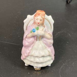 vintage Foreign miniature porcelain seated girl on chair with blue flower