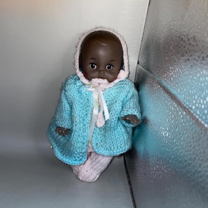 1950s vintage black doll ,hard plastic,vinyl head , sleeping   eyes,dressed