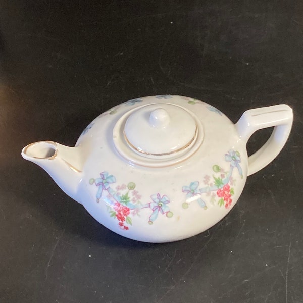 vintage, unmarked  small porcelain white with pink flowers and ribbons gilded teapot