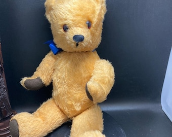 vintage growling teddy bear with joined paws