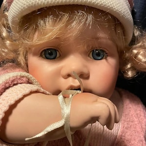 Large seated  porcelain girl in pink with ice cream doll with soft body,