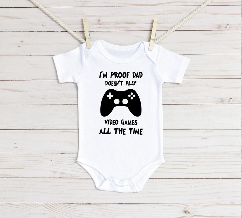 I/'m Proof Dad Doesn/'t Play Video Games All The Time Baby Onesie\u00ae