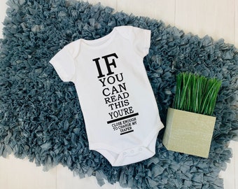 If You Can Read This Change My Diaper Baby Onesie®
