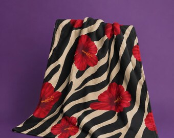 Couverture polaire zébrée hibiscus rouge | Plaid imprimé floral et animal | Décoration tropicale tendance