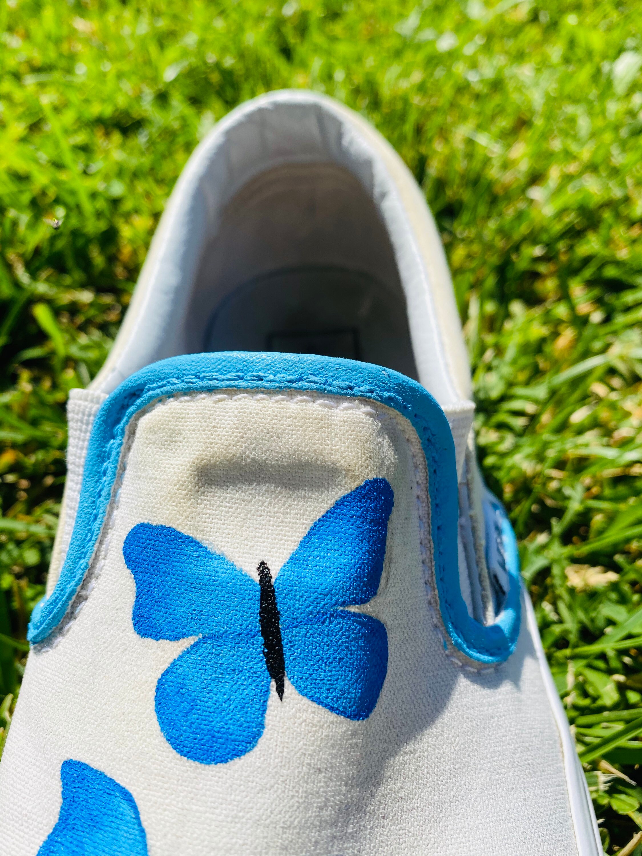 blue butterfly slip on vans