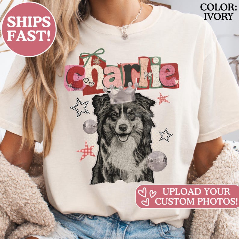 May include: Ivory-colored t-shirt featuring a graphic of a dog wearing a crown, the name "Charlie", and decorative elements. The shirt has the text "UPLOAD YOUR CUSTOM PHOTOS!" and "COLOR: IVORY".