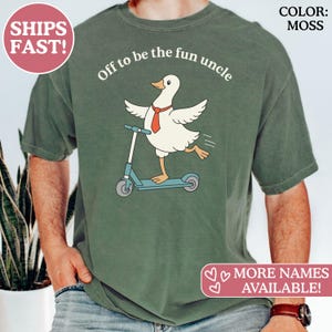May include: Moss green t-shirt with a graphic of a goose riding a scooter, wearing a red tie. Text reads "Off to be the fun uncle." Additional text says "MORE NAMES AVAILABLE!"