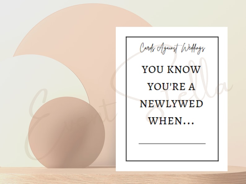 May include: A white card with black text that reads "Cards Against Weddings" and "You know you're a newlywed when..." with a blank line for filling in the answer.
