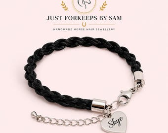 May include: A black braided horse hair bracelet featuring silver-toned metal end caps, a lobster claw clasp, and an adjustable chain. A heart-shaped silver-toned charm is attached to the clasp, engraved with the name Skye in a cursive script.
