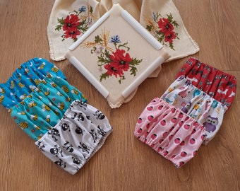 May include: Three sets of fabric scraps with different patterns. The first set is blue and turquoise with a bee pattern. The second set is white with a black skull and crossbones pattern. The third set is pink with a red ladybug pattern.