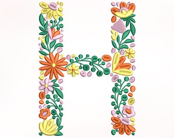 Può includere: Lettera H ricamata con fiori con uno stelo verde, fiori arancioni, gialli e rosa.