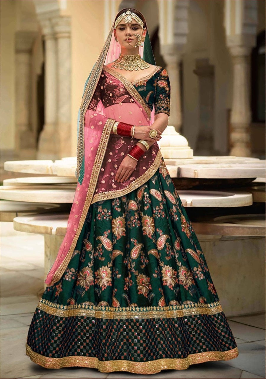 Red and green bridal lehenga sabyasachi sales