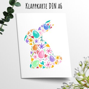 Klappkarte Grußkarte Ostern Hase aus Eiern Blüten und Herzen Bunt Wasserfarben Optik
