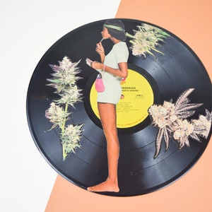 Curiosity Unleashed: Upcycled Unplayable Record Painted with Inquisitive 1960&#39;s Girl Amidst Sativa Plants Modern art