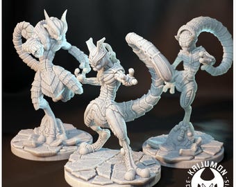 May include: Three white, stylized figurines of a creature with a humanoid form and a long tail. The figures are posed on cracked, circular bases. The text "BECCA_3D" and a logo for "Kaijumon 3D Printing Minis" are visible.