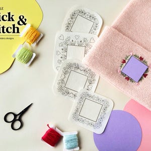 May include: A light pink knit beanie with an embroidered floral square frame, four white square adhesive embroidery patterns, small spools of yellow, green, red, and light blue embroidery thread, and black scissors. Text reads: PRINTABLE Stick & Stitch.