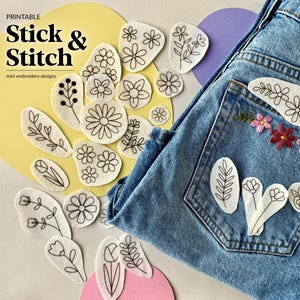 May include: Printable Stick & Stitch mini embroidery designs featuring various black line art floral patterns on white fabric patches. Some patches are applied to the back pocket of blue denim jeans, including one with finished pink and red stitching.