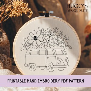 May include: A beige fabric stretched in a wooden embroidery hoop features a black line drawing of a vintage van with a floral arrangement on top. The text "Printable Hand Embroidery PDF Pattern" is at the bottom. The words "HUGO'S DESIGN SUITE" are at the top.